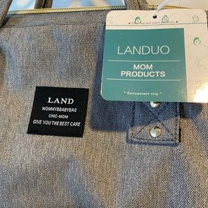 NWT Land Diaper bag with accessories.